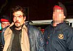 Francisco Javier Picatoste (izquierda) y Manuel Brito, anoche, al entrar en la comisara
