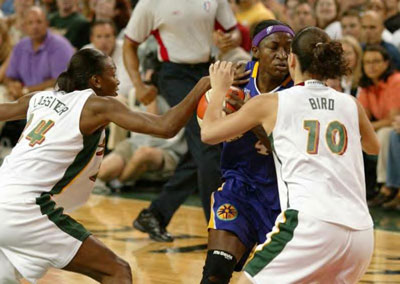 Sue Bird and Amanda Lassiter guarding Mwadi Mabika
