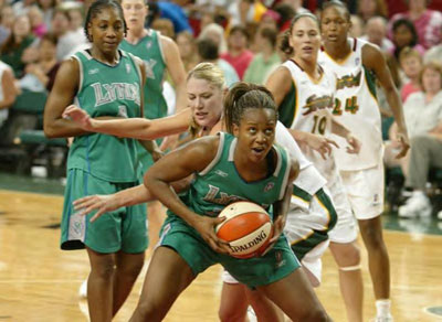 Sue Bird looking on