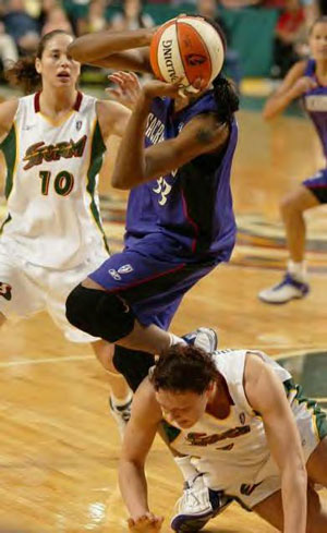 Sue Bird in the background.
