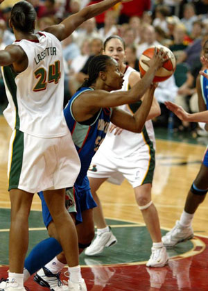 Sue Bird looking on