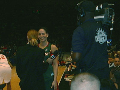 Sue Bird is smiling toward our direction