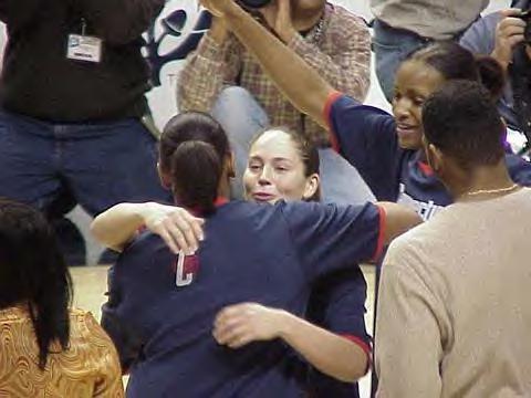 Sue Bird gives Asjha Jones a hug