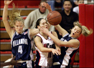 Sue Bird, Katie Davis and Trish Juhline Battling for the Ball