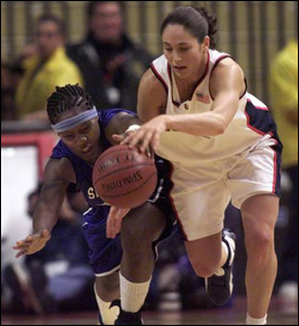 Sue Bird and CharleneThomas are battling to gain possesion of the ball