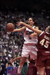 Sue Bird is blocked by Jamie Talbert