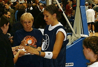 Rebecca Lobo is signing autograph before the game