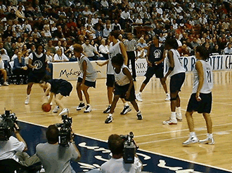 Sue is dribbling down low