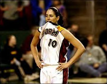 Sue Bird bites  her jersey