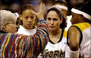 Sue Bird and Teammates getting pointers from Linn Dunn 
