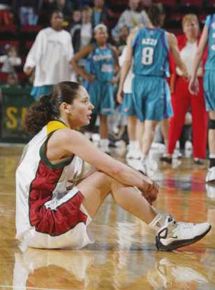 Sue Bird sits on the floor