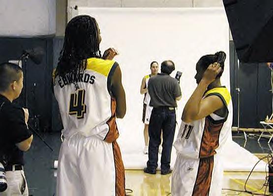 Simone Edwards and Jamie Redd are waiting for Sue Bird to finish her shooting session