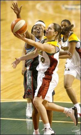 Sue Bird Drives against Robinson