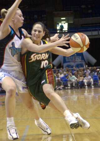 Sue Bird Drives Against Penny Taylor
