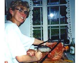 Jana is cutting up pig's head...