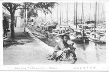 [A street scene along the Chinese Bund.]