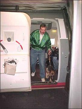 Brian and Puppy Sirius exiting the plane
