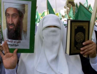 A 

Muslim holding the Koran in his left hand and in the right hand, he holds a gun. 

Perfect combination!!!