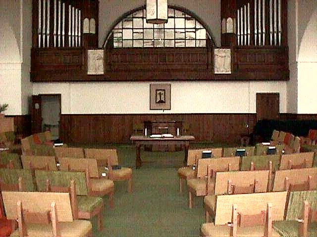 First Baptist Sanctuary. Note pipe organ and individual chairs - allowing for a variety of presentations