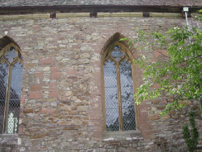 13th century windows each east of a small Norman window