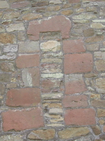 Norman window with straight cap-stone