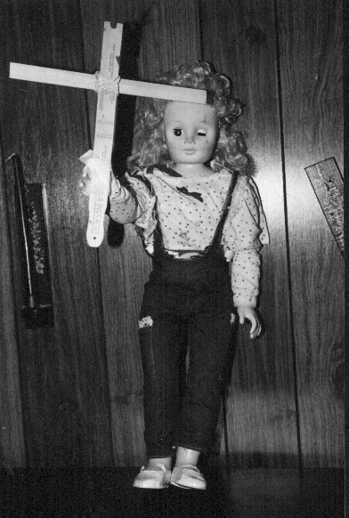 A cursed Devil-Doll from hell wreaks havoc and seaks fresh buttock flesh!