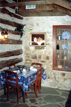 The kitchen has an antique wood burning stove which has been converted to electric having 2 burners (no oven). A small refrigerator, microwave, toaster and coffeemaker are also provided. Dishes are in the old pie safe. 