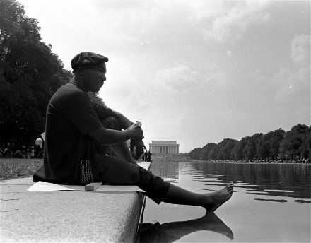 An unidentified marcher cools his feet at the Reflecting Pool near the Lincoln Memorial during the March on Washington, August 28, 1963. Photo courtesy US State Department.