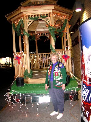 Mrs. Stewart stands beside the Gazebo
