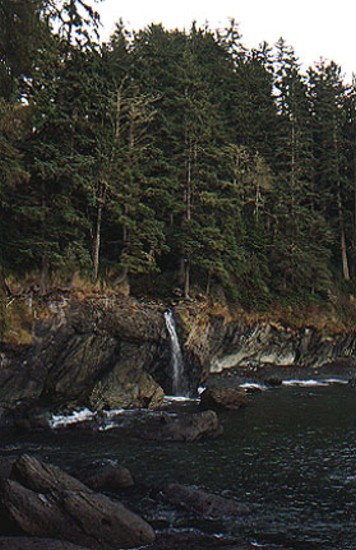 A waterfall into the ocean at high tide