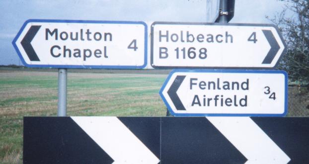 Sign at Holbeach St Johns to the Fenland Airfield, Moulton Chapel and Holbeach.