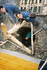 Roma workers digging the well