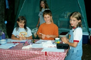 Kids doing artwork at the camp site
