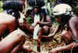 A little black magic ceremony. The witchdoctor used a plastic bag for a hair net. Zippers were popular as head bands.
