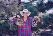 Sheila showing off a pair of coulter pine cones