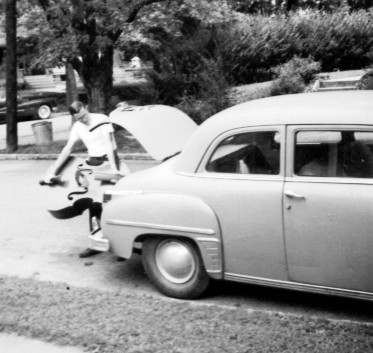 Glenn Chesnut putting a string bass in his car