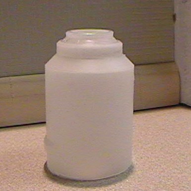 The cut-off end of the toner bottle.
