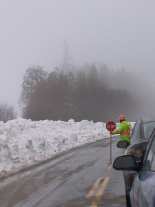 Clearing 6 feet high snowbanks across the road - there's a railway line the other side of this bank