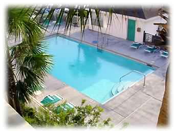 Our heated pool at the Gulf View Condo.  Watch your kids play from our gated private front porch.