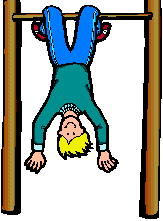 boy swinging upside-down from bar