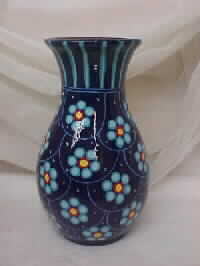 Blue Vase with Lilac Colored Flowers