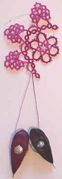 Tatting in progress with single bobbin shuttles.