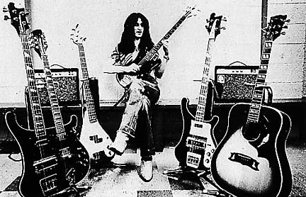 Geddy practicing surrounded by his Rickenbachers