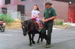 A young cowgirl learns the ropes.