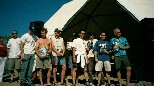 Prize presentation for kite-surf and buggy event. From left to right. ?, Neil Godbold, ?, ?, ?, ?, ?, Dom Early, Mark Kingshott, Andy Sands.