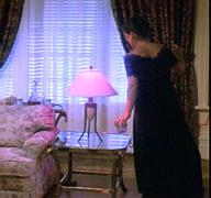 the table lamp at the far end of the loveseat