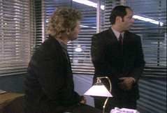 the corner of Reese's office, common with the squad room and the end office