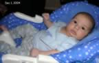 Kaden hanging out in his swing (28kb)