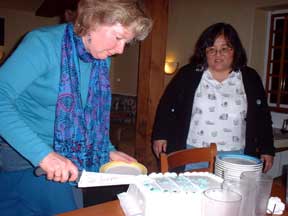 Claudine cutting cake