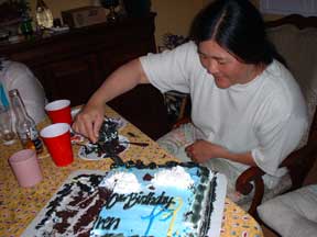 Monica removing black frosting.